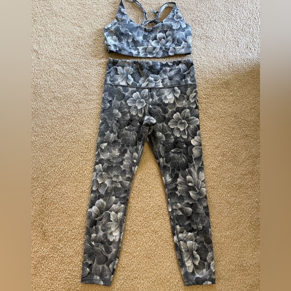 Athleta black and white textured floral design sports bra and cropped leggings.